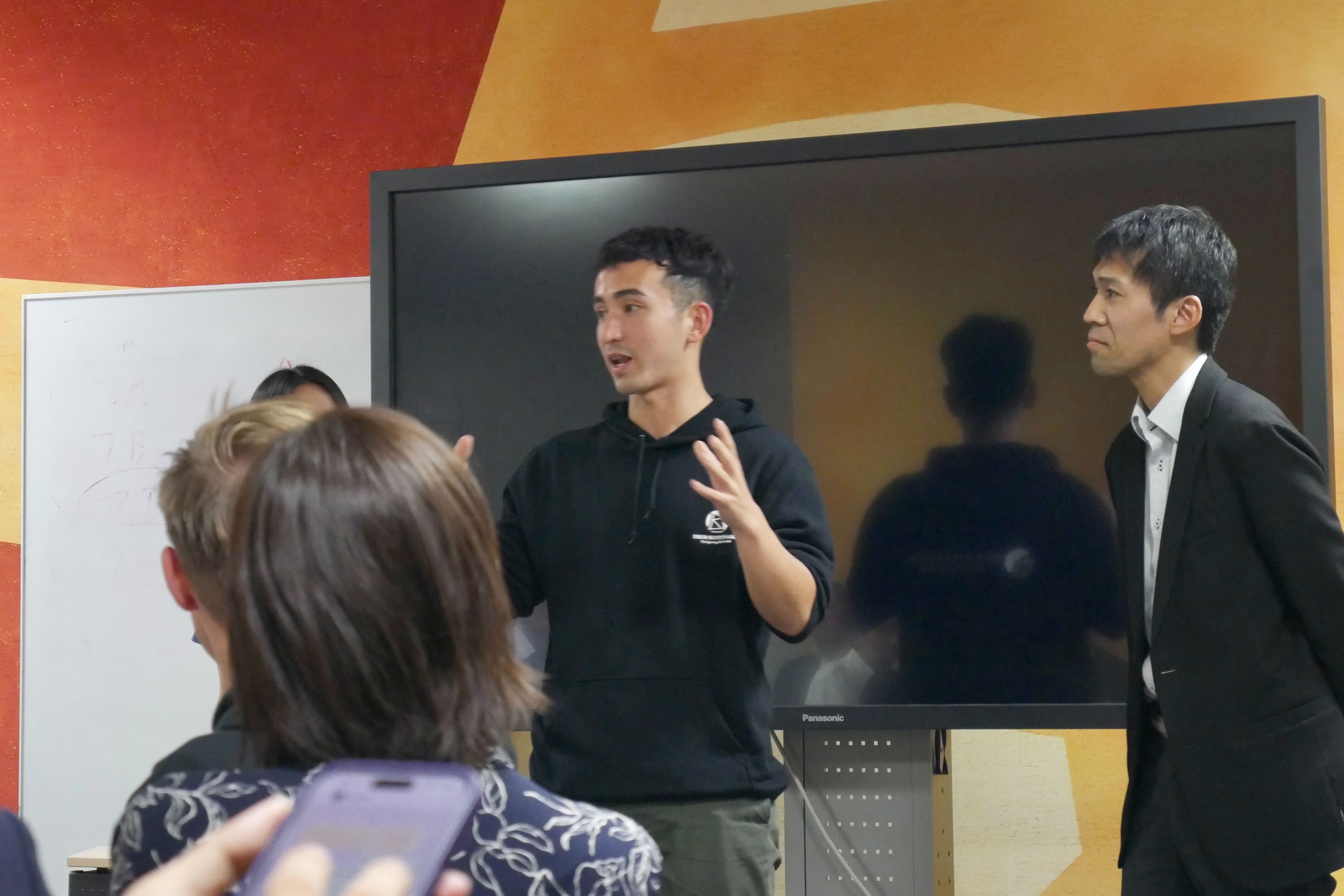 A student and a Nissan participant in open debate